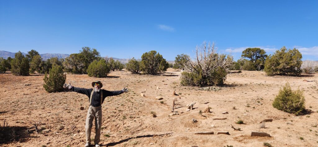 happy volunteer in restored area of Grand Stair Case Escalante, Wilderness Volunteers project